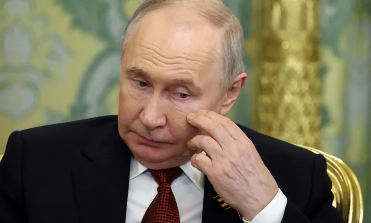 путін