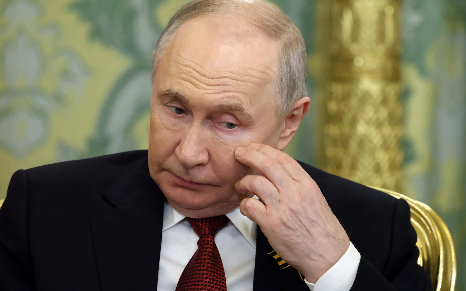 путін